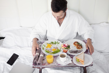 Breakfast in bed for bearded dark-haired sexy manly man