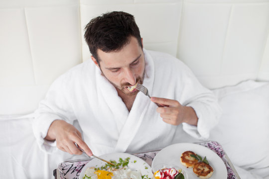 Breakfast in bed for bearded dark-haired sexy manly man