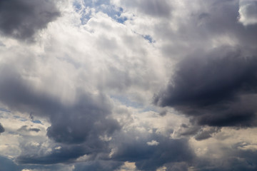 Clouds after rain before sunset as a background