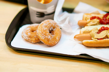 sandwiches potato free snack and dessert on a tray in fast food restaurant f