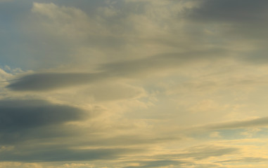 Clouds after rain before sunset as a background