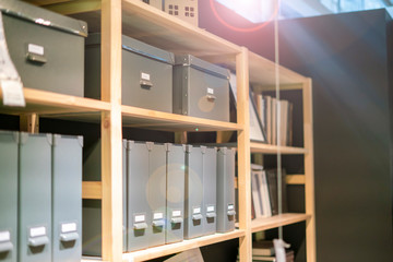 home workshop with books and other papers on the rack shelf and in the crate v