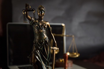 Lady Justice isolated on black background