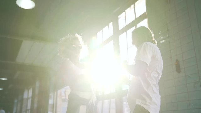 couple dancing in urban place.
