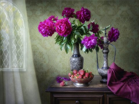 Still life with beautiful bouquet of magenta peonies