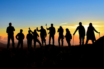 crowd of climbers team, walking, summit adventures and tranquility at sunrise time