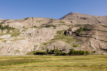 Fertile Wakhan Valley in Tajikistan with the Pamir Mountains