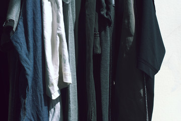 Clothes hanging from rail dry in the sun