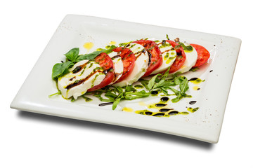 Caprese. Appetizer with fresh tomatoes and mozzarella cheese
