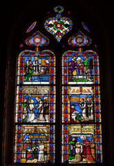  Colorful Stained Glass in medieval Sarlat Cathedral  dedicated to Saint Sacerdos. Sarlat la Caneda in Dordogne Department, Aquitaine, France