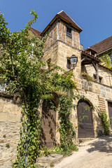 Fototapeta na wymiar Sarlat, France - September 2, 2018: Historic houses along Montagne street in Sarlat la Caneda in Dordogne Department, Aquitaine, France