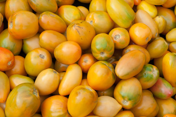 fresh tomatoes selling at vegetable market