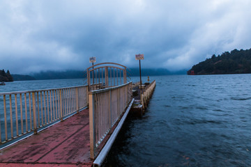 Pier in Hakone national park at Ashi lake in the evening