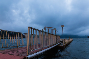 Fototapeta premium Pier in Hakone national park at Ashi lake in the evening