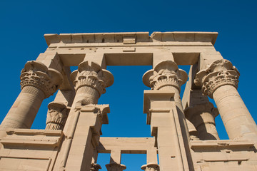 Hieroglyphic carvings on columns at an ancient egyptian temple