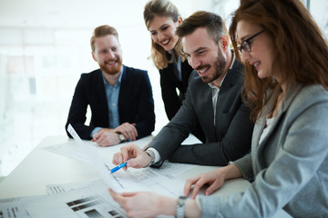 Business people working together on project and brainstorming in office