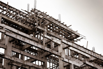 Low angle view of structure concrete building in sepia tone.