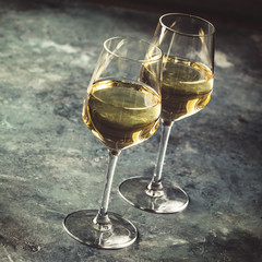 White wine on the stone background, close up