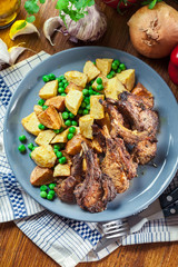 Roasted lamb chops served with baked potatoes