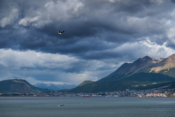 City of Ushuaia and dark stormy sky. Argentina