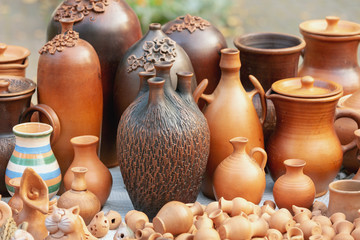 Fototapeta na wymiar Various ceramic products from clay. Comfortable and functional with a different shape of brown clay for food and beverage products from clay. Outdoor photography