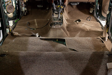 Dry-cleaning of the salon and restoration of the car’s floor covering at the service station with professional tools, replacement of the material made by custom-made masters.