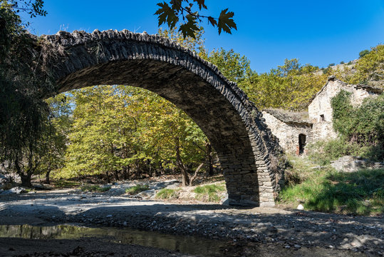 View of a traditional stone bridge and a ruined watermill near Elassona in Thessaly, Greece