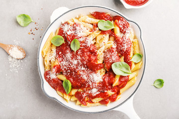 Tomato italian penne pasta served in pan