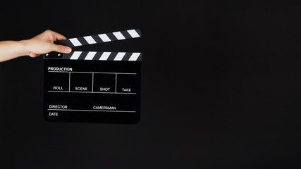 Hand's holding black Clapperboard or clap board or movie slate use in video production ,film,...