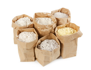 Flour and flour mixture in paper bags isolated on white