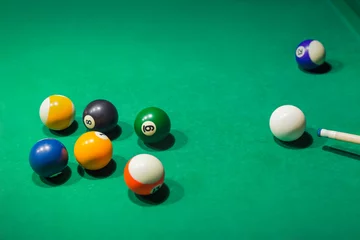 Foto op Plexiglas Billiard balls on pool green table © Nikolai Sorokin