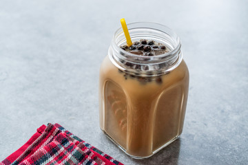 Homemade Milk Bubble Tea with Tapioca Pearls in Mason Jar.