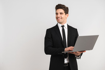 Smiling business man wearing suit standing