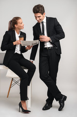 Full length portrait of a happy young business couple