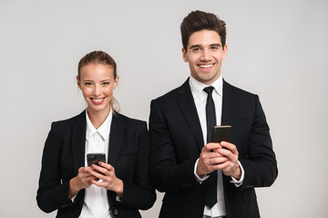Portrait of a confident young business couple wearing suits