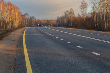 Fototapeta premium Country highway, freshly repaired, sunny autumn day