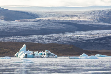 Eisberg in lagoon with glacier background, Iceland