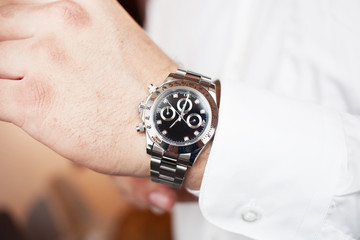 watch closeup on male hand business or fashion concept