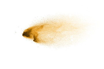 Golden sand explosion isolated on white background. Abstract sand splashing.