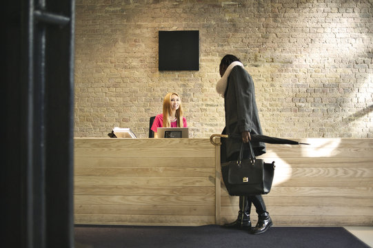 Asian woman at a company reception area