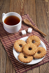 Shortbread cookies and tea on table