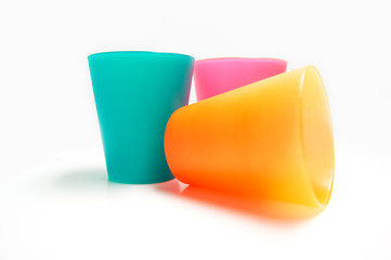 colorful plastic cups isolated on white background