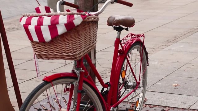 VIntage red bike with basket in the street