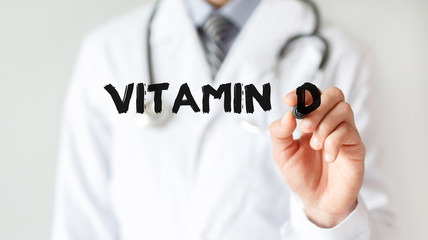 Doctor writing word Vitamin  d with marker, Medical concept - obrazy, fototapety, plakaty