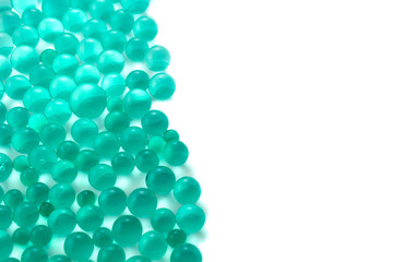 Abstract background with green hydrogel balls with copy space