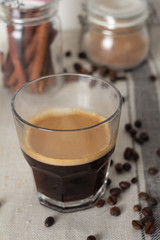 black coffee, coffee beans and spices.