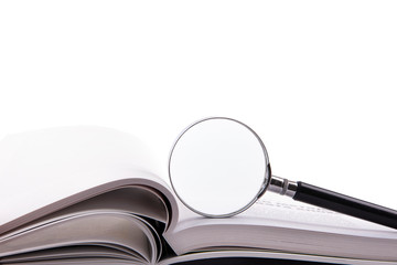 Magnifying glass and blank book.