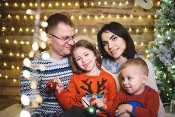 family in festive sweaters