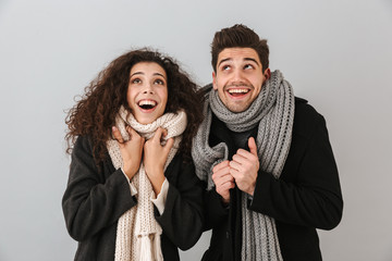 Cheerful young couple wearing sweaters