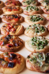 Freshly baked mini pizzas Cocas